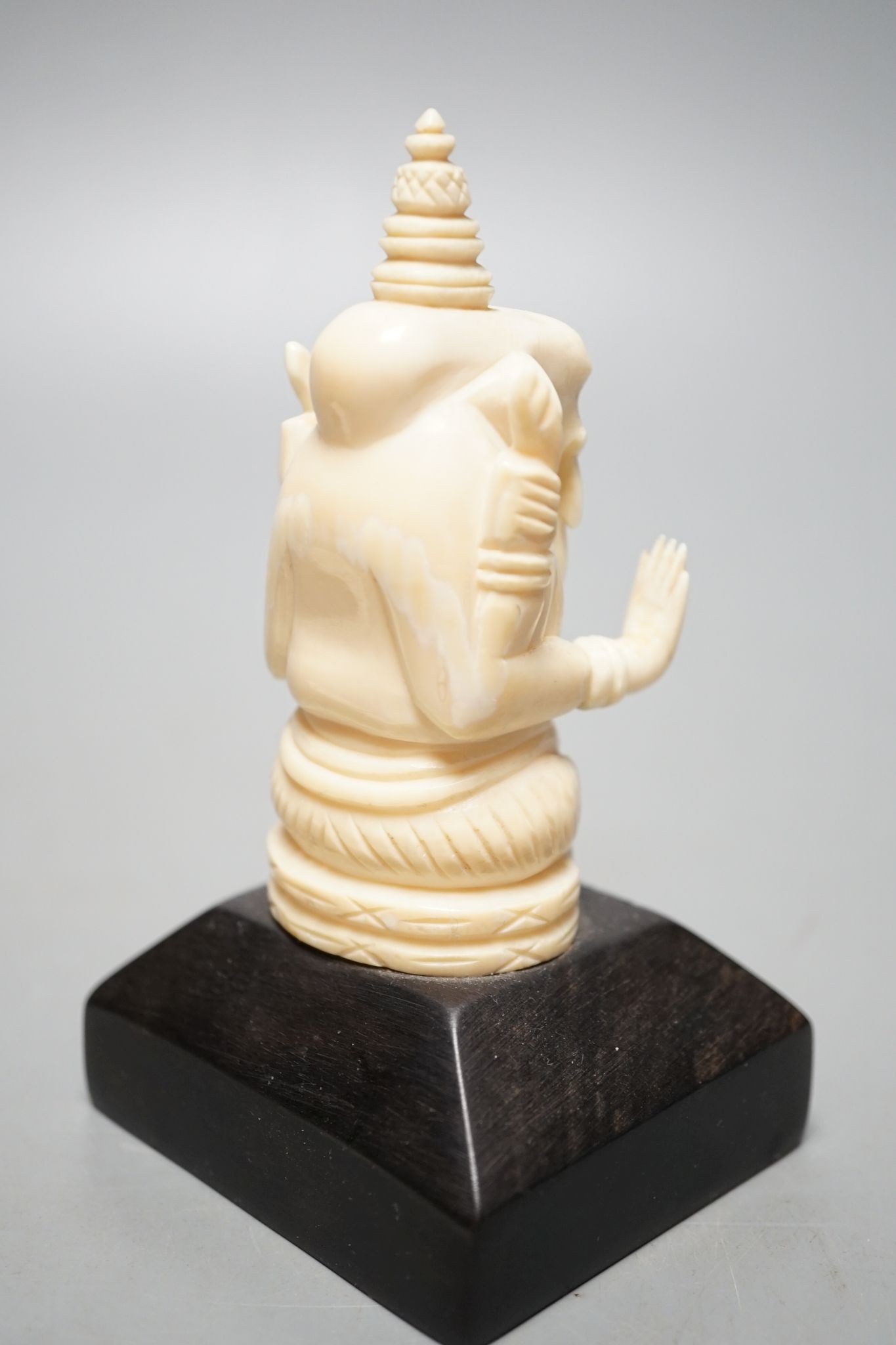 An Indian ivory letter opener, 38cm, and a Ganesh figure